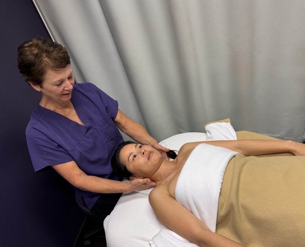 Registered massage therapy at Vancouver clinic Cross Roads Physiotherapy & Massage Therapy located on West Broadway at Cambie Village, RMT Dawn Sparks providing massage therapy for neck pain
