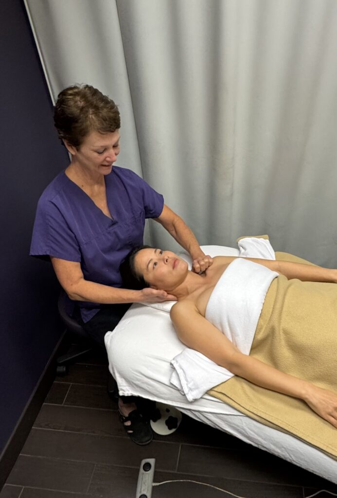 Registered massage therapy at Vancouver clinic Cross Roads Physiotherapy & Massage Therapy located on West Broadway at Cambie Village, RMT Dawn Sparks providing massage therapy for neck pain